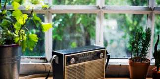 SKN TransWater Project Consultant & Stakeholders to Make Media Appearance Closeup of vintage radio on wooden table
